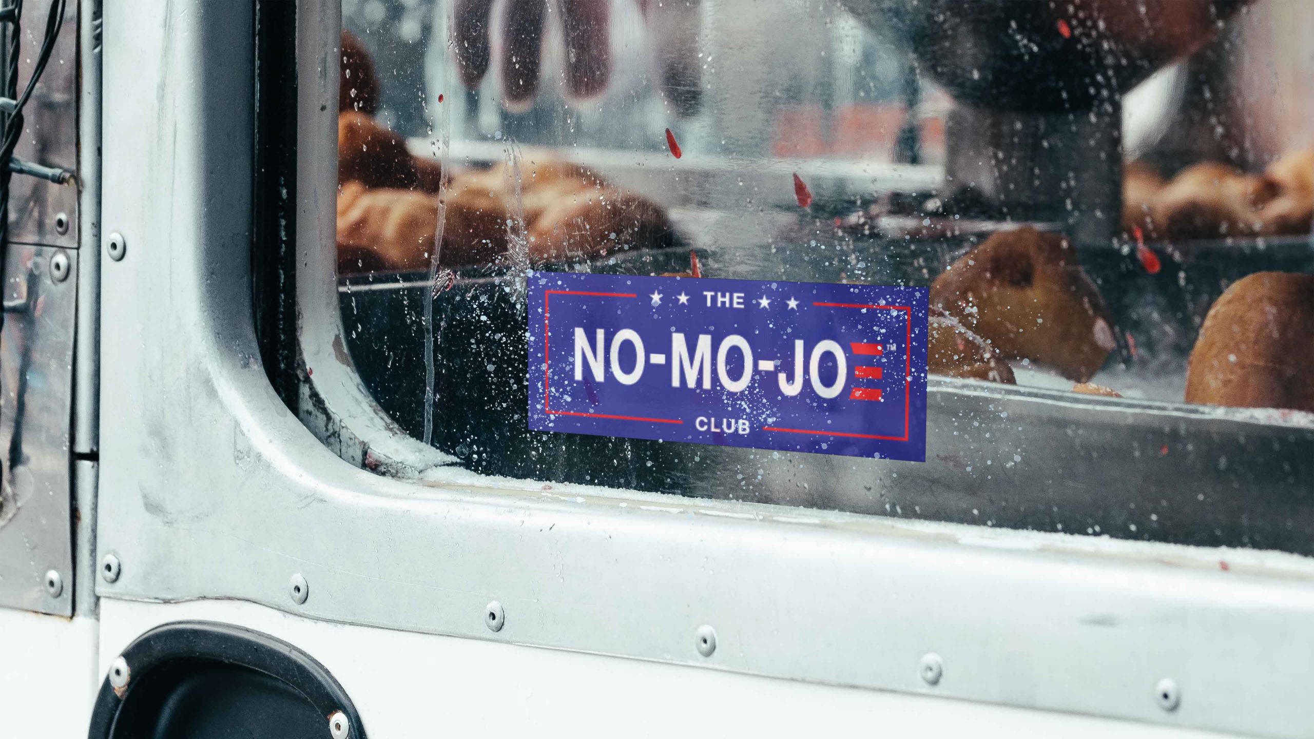The No-Mo-Joe Club™ window cling on frosty window of utility truck
